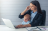 Business Lady on phone and laptop nursing baby