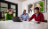 Three office workers sat around a table