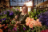 Woman cutting flowers in flower shop