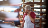 Older Lady on the phone in a warehouse, making an action plan