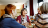 Group of friends sitting round a table in a nursing home