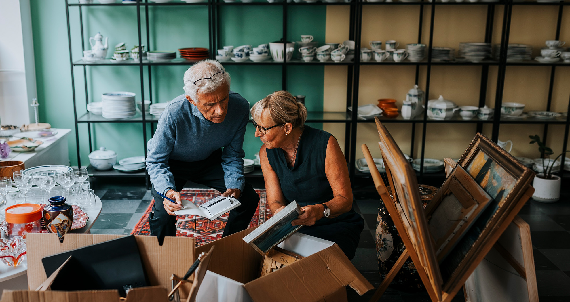 Lady shopping in an antiques store asking the shop owner for support