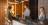 Young woman checking in at a Hotel reception desk.